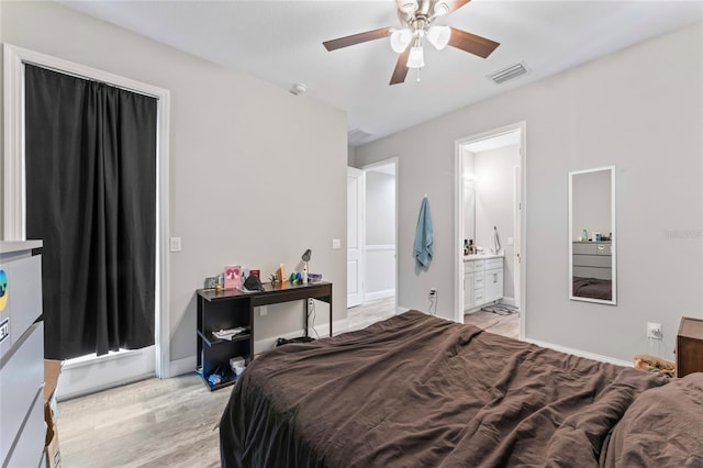 bedroom featuring baseboards, visible vents, ceiling fan, ensuite bathroom, and light wood-style floors