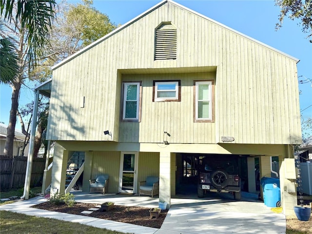 rear view of house with a garage