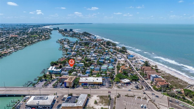 drone / aerial view with a water view and a beach view