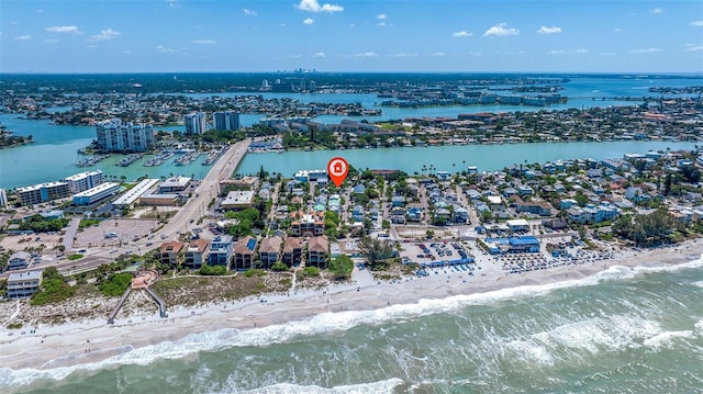 aerial view with a water view and a beach view