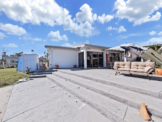 view of front of home with a patio and an outdoor hangout area