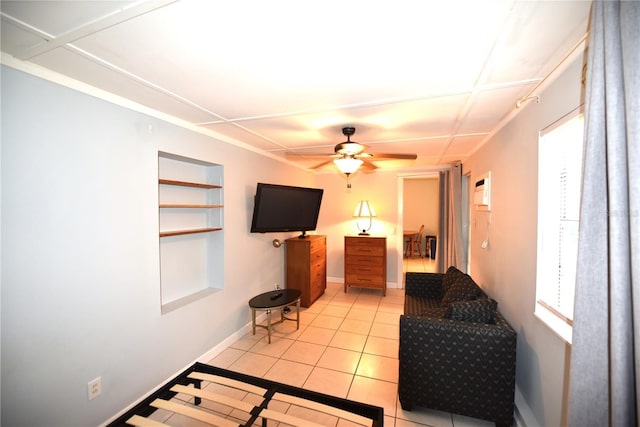 1372 Palmetto St, Clearwater, FL 33755 - living room with a ceiling fan, light tile patterned floors, baseboards, and built in shelves
