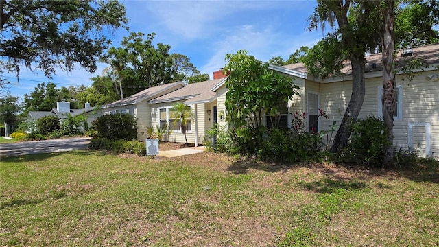 1372 Palmetto St, Clearwater, FL 33755 - view of side of home featuring a yard