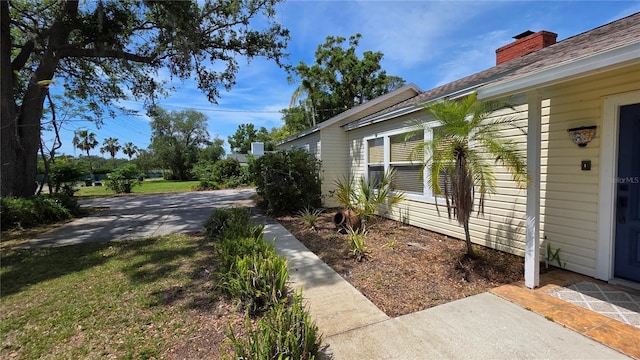 1372 Palmetto St, Clearwater, FL 33755 - view of home's exterior featuring a chimney