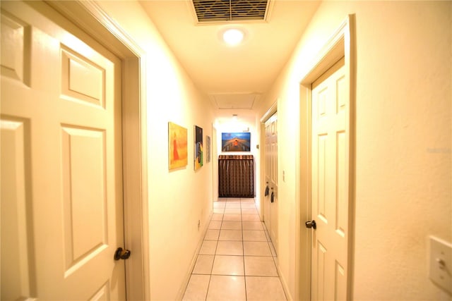 1372 Palmetto St, Clearwater, FL 33755 - hallway featuring light tile patterned floors, attic access, and visible vents