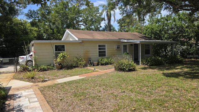 1372 Palmetto St, Clearwater, FL 33755 - ranch-style house with a gate, fence, and a front yard