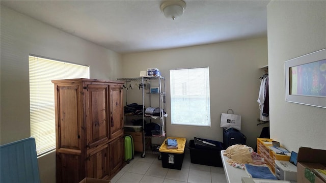 1372 Palmetto St, Clearwater, FL 33755 - clothes washing area featuring light tile patterned floors
