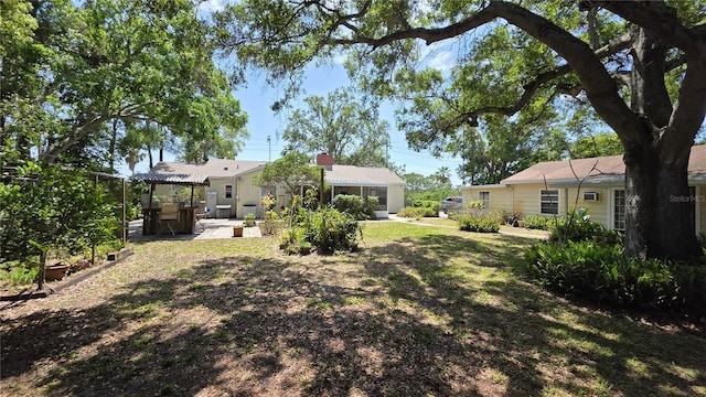 1372 Palmetto St, Clearwater, FL 33755 - view of yard with a pergola and a patio area