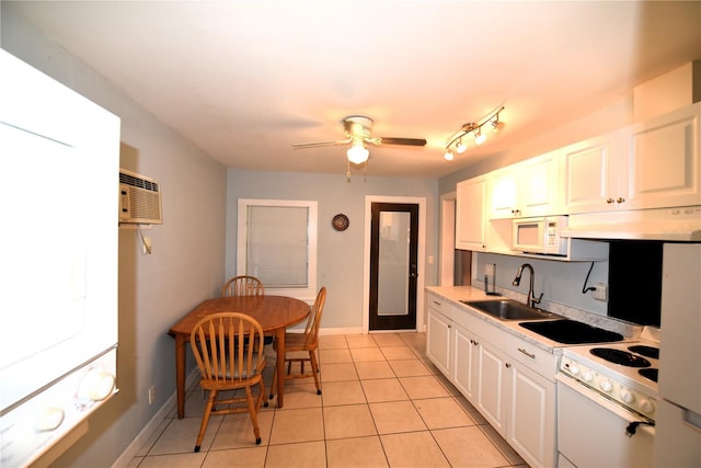 1372 Palmetto St, Clearwater, FL 33755 - kitchen featuring white appliances, light countertops, a sink, and light tile patterned floors