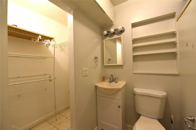 1372 Palmetto St, Clearwater, FL 33755 - bathroom featuring toilet, tile patterned flooring, and vanity