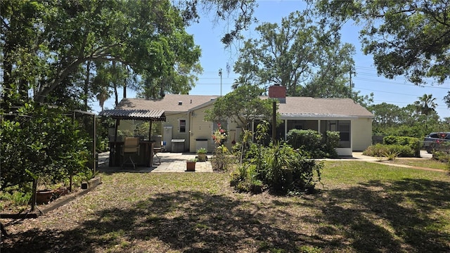 1372 Palmetto St, Clearwater, FL 33755 - back of house with a patio, a yard, and a pergola