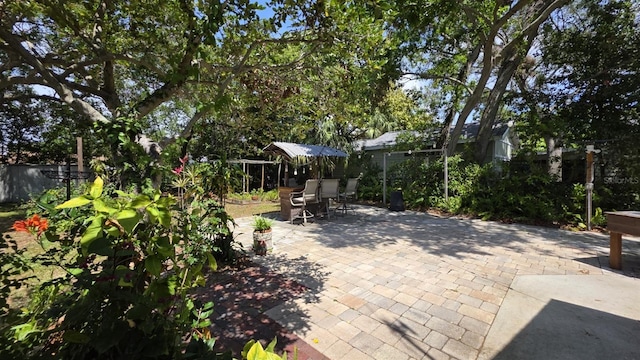 1372 Palmetto St, Clearwater, FL 33755 - view of patio featuring outdoor dining area and fence