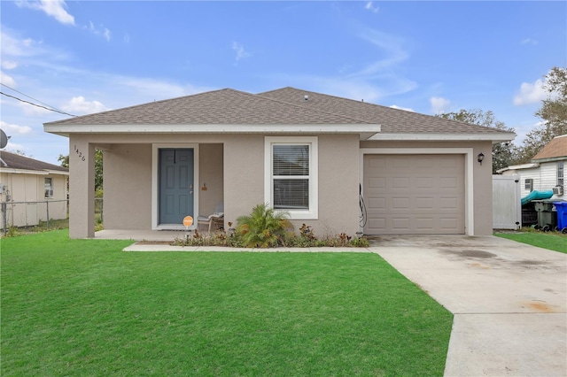 view of front facade with a garage and a front lawn