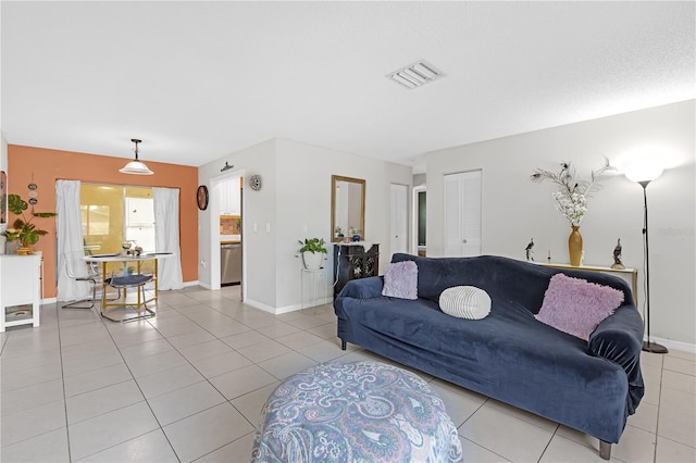 living room with light tile patterned floors