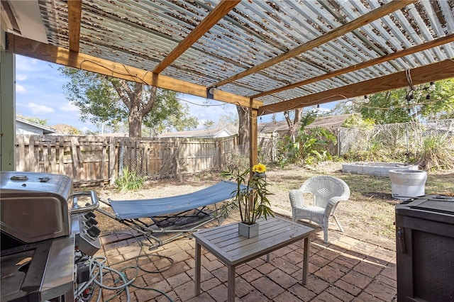 view of patio / terrace featuring area for grilling and a pergola