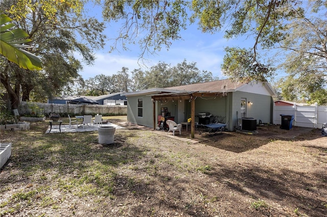 back of house featuring a patio and central air condition unit