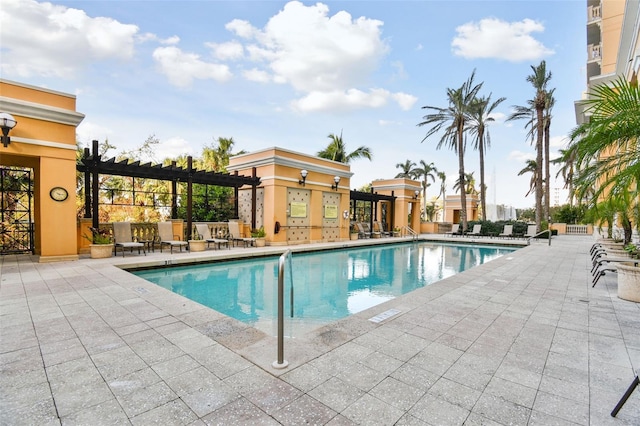 pool with a pergola and a patio