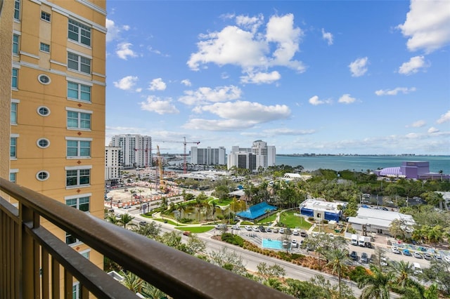 balcony featuring a city view and a water view