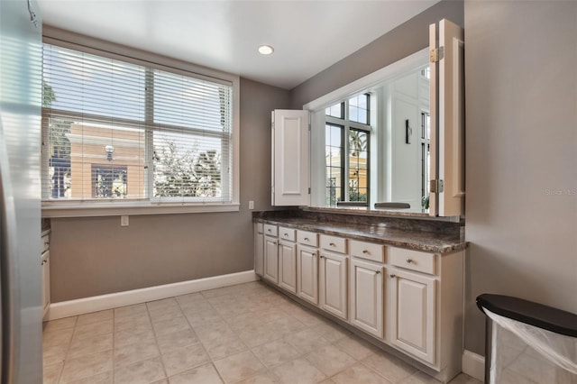 bathroom featuring recessed lighting, baseboards, and vanity