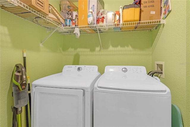 laundry room with washing machine and clothes dryer