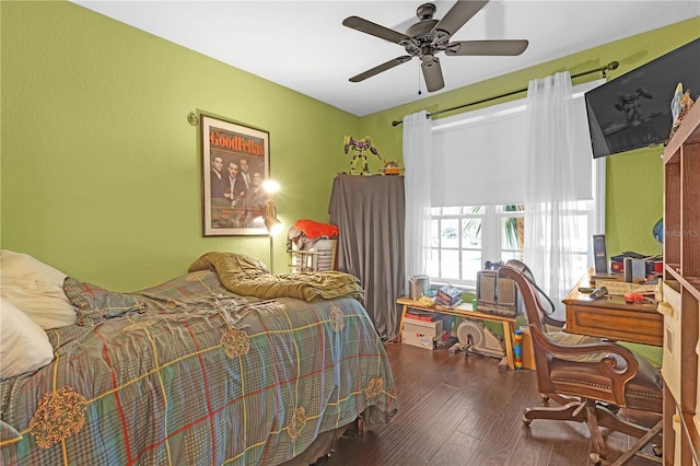 bedroom featuring ceiling fan and dark hardwood / wood-style flooring