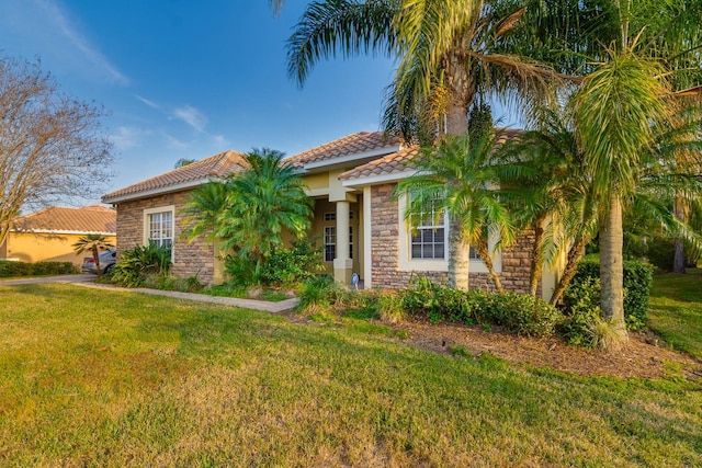 10534 Bermuda Isle Dr, Tampa, FL 33647 - mediterranean / spanish-style home featuring a front yard