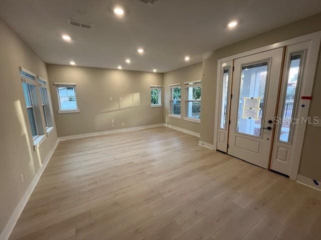 foyer entrance featuring light hardwood / wood-style floors