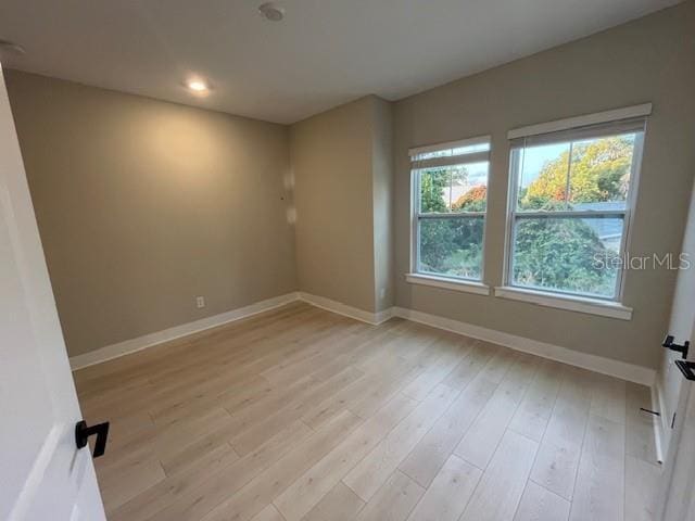 empty room featuring light hardwood / wood-style floors