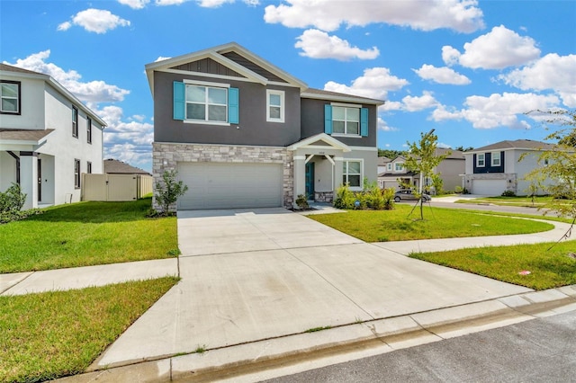 view of front of house with a garage and a front yard