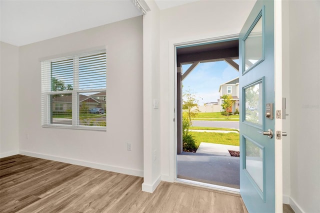 entryway with light hardwood / wood-style flooring