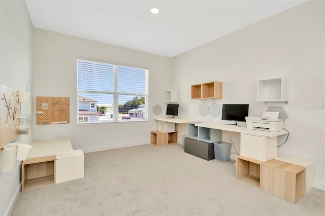 office area featuring light colored carpet