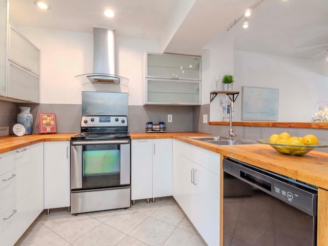 kitchen featuring wooden counters, dishwasher, white cabinetry, electric range, and ventilation hood