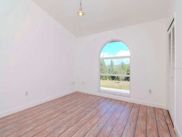 empty room with light hardwood / wood-style floors