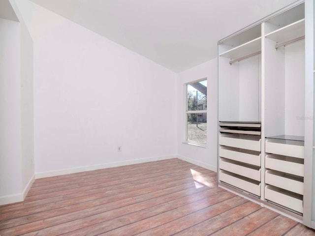 spacious closet with light hardwood / wood-style floors