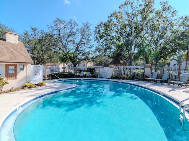 view of swimming pool with a patio