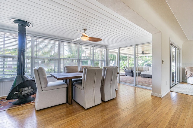 sunroom featuring ceiling fan