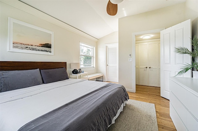 bedroom featuring vaulted ceiling and light hardwood / wood-style floors