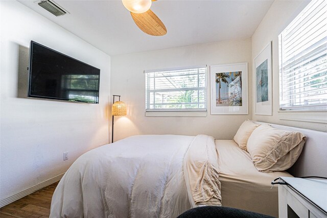 bedroom with hardwood / wood-style floors and ceiling fan