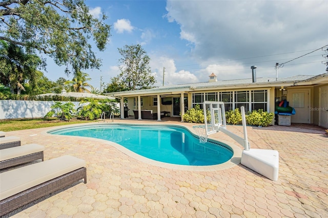 view of pool featuring outdoor lounge area and a patio