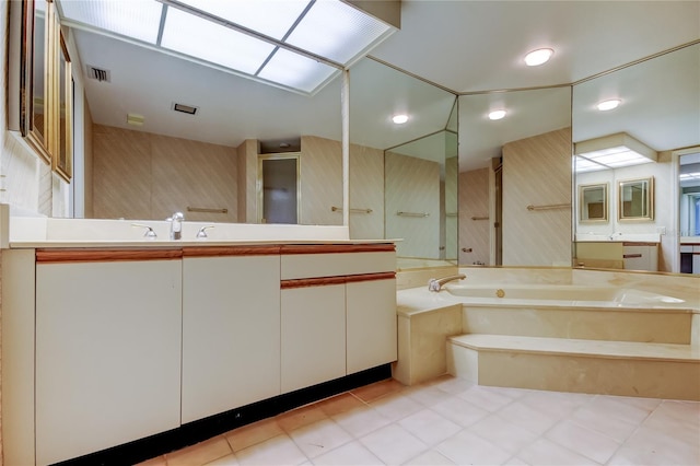 bathroom with vanity and a tub