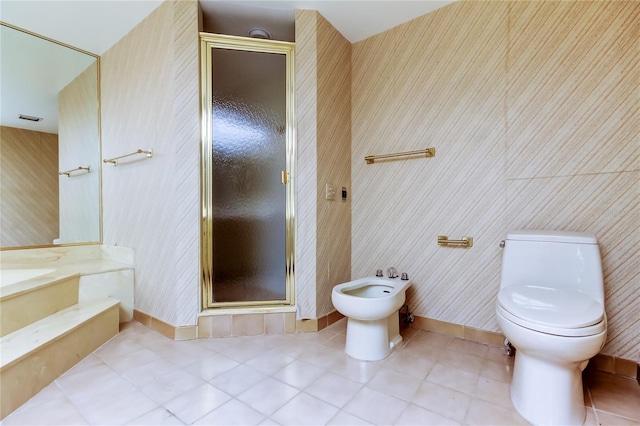 bathroom with an enclosed shower, tile patterned floors, toilet, and a bidet