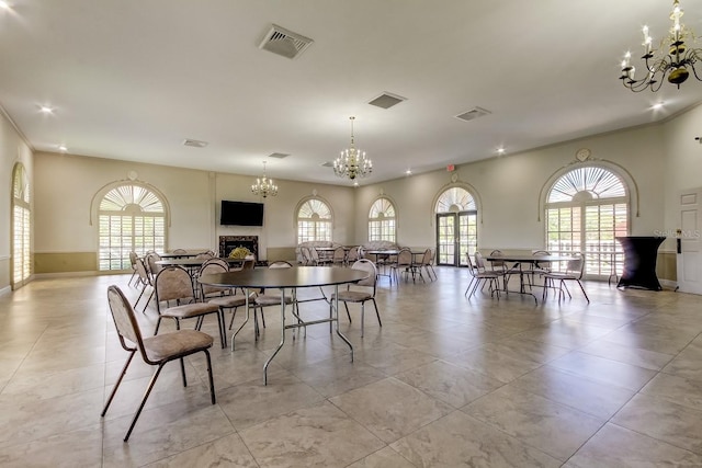 dining room with light tile patterned floors and a chandelier