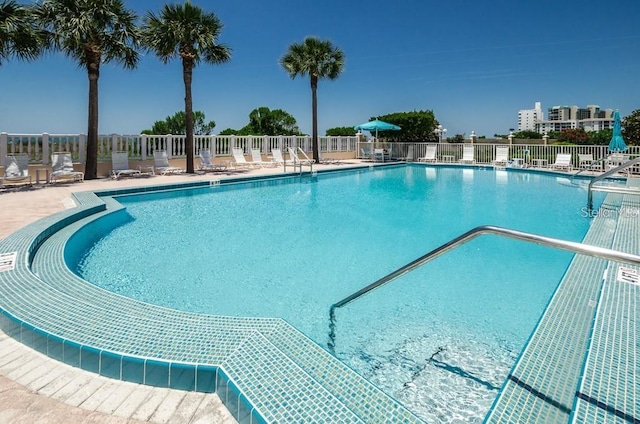 view of swimming pool featuring a patio area