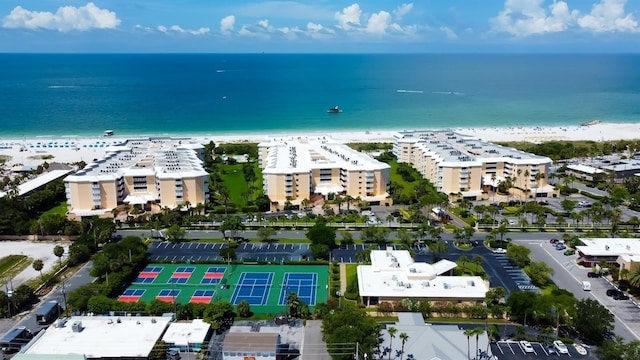 bird's eye view featuring a view of the beach and a water view