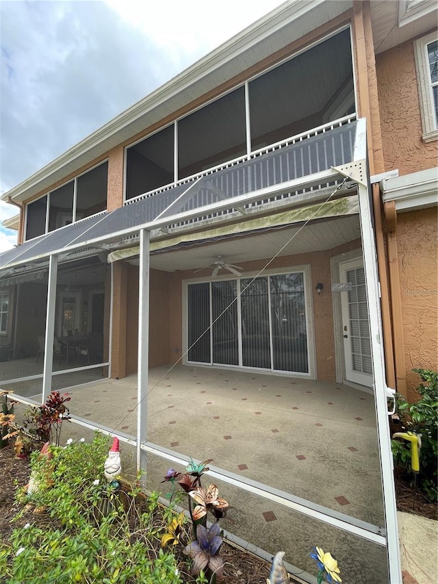 rear view of house featuring a balcony