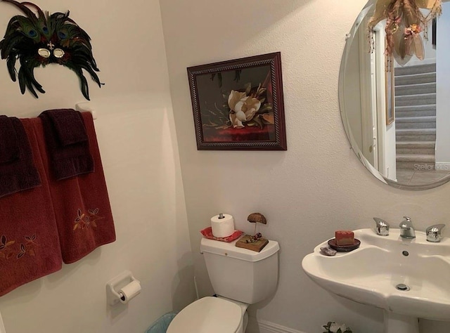 bathroom with toilet and sink