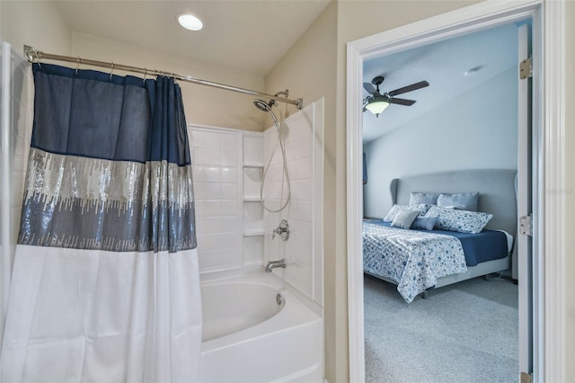 bathroom featuring lofted ceiling, shower / bath combination with curtain, and ceiling fan