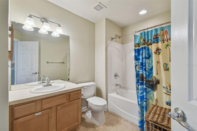 full bathroom featuring tile patterned flooring, vanity, toilet, and shower / bath combo with shower curtain