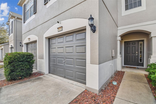 doorway to property featuring a garage