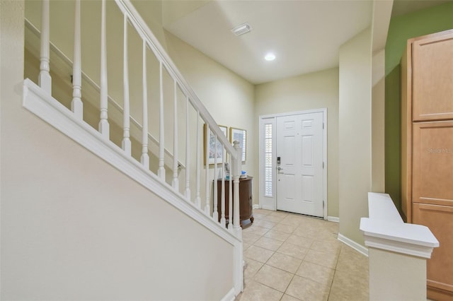 foyer featuring light tile patterned floors